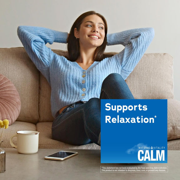 View 5 A young woman smiles, relaxing on a sofa with her hands behind her head, next to a Calm product graphic.