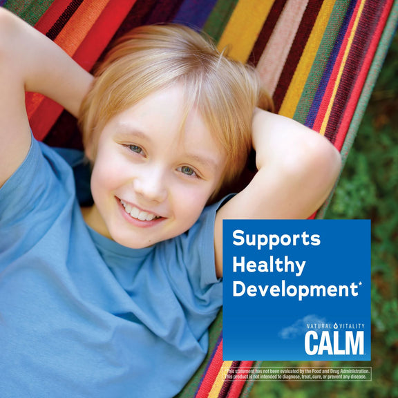 View 4 Young boy smiling in a hammock with a Calm product graphic saying 'Supports Healthy Development'.