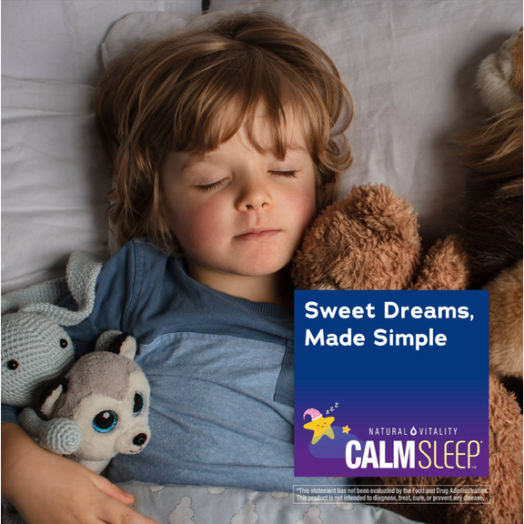 View 4 A young child sleeps in bed with stuffed animals, next to Natural Vitality Calm Sleep.