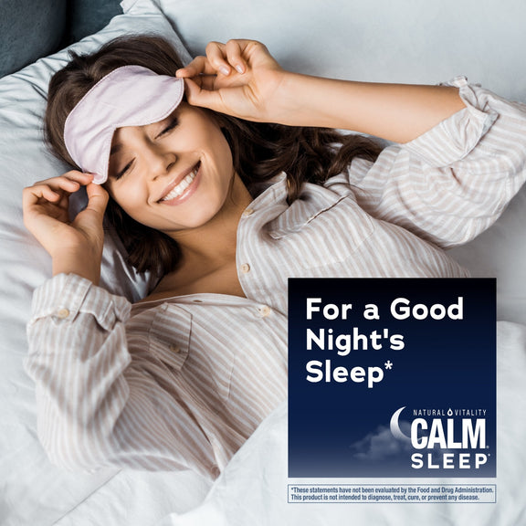 View 5 Young woman smiling in bed, adjusting a pink sleep mask, with a Calm Sleep graphic overlay.
